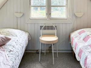 Un pat sau paturi într-o cameră la Holiday Home Strandgårdsvej III