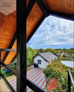 a view from a window of a house with a roof at Lotca lu Vasile in Crisan