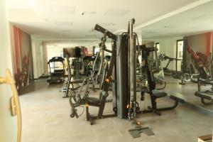 a gym with several tread machines in a room at Lunare Hotel Pinheiros in Sao Paulo