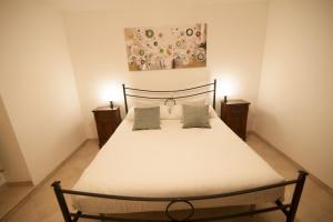 Un pat sau paturi într-o cameră la Casa vacanze Castello