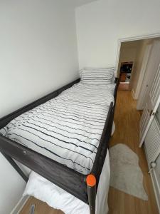 a large bed in a room with at 3 Bedroom Apartment, Flat in London in Forest Hill