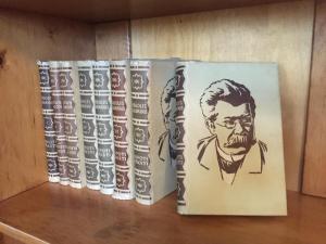 two books sitting on top of a shelf at Apartamenti Kuldīgas Pilsdzirnavas in Kuldīga
