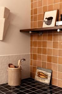 a corner of a kitchen with a toilet and a shelf at Log Box Red Hill in Red Hill South