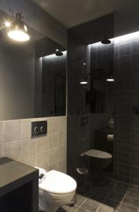 a bathroom with a toilet and a shower at Skuggi Hotel by Keahotels in Reykjavík