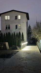 a building with lights on the side of a street at S35 in Białystok