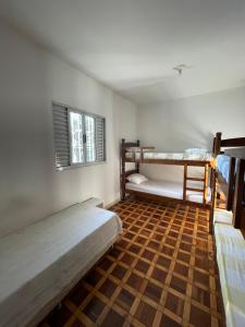 Postel nebo postele na pokoji v ubytování Quarto privativo em residência ótima localização