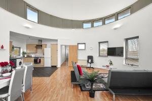 an open kitchen and living room with skylights at Livestay - Two Bed London Apt with Balcony in Colindale