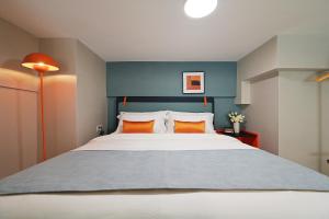 Ένα ή περισσότερα κρεβάτια σε δωμάτιο στο Livetour Hotel Panyu Nancun Wanbo Metro Guangzhou