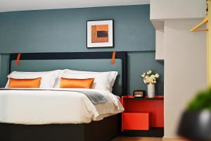 Ένα ή περισσότερα κρεβάτια σε δωμάτιο στο Livetour Hotel Panyu Nancun Wanbo Metro Guangzhou