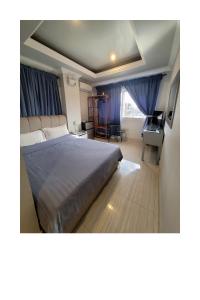 Postel nebo postele na pokoji v ubytování 한라호텔 Halla Hotel