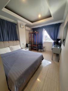Postel nebo postele na pokoji v ubytování 한라호텔 Halla Hotel