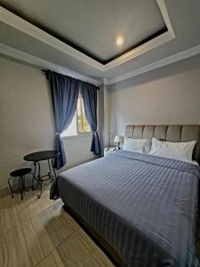 Postel nebo postele na pokoji v ubytování 한라호텔 Halla Hotel