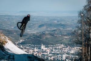 a person doing a trick on a bike in the air at Boutique Hotel Pohorje in Maribor