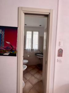 a bathroom with a toilet and a sink at La Dolce Vita in Levanto