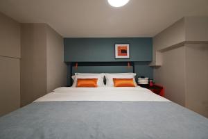 Ένα ή περισσότερα κρεβάτια σε δωμάτιο στο Livetour Hotel Panyu Nancun Wanbo Metro Guangzhou