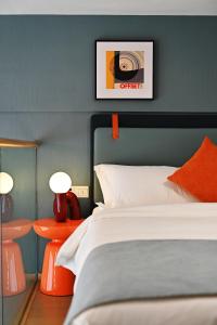 Ένα ή περισσότερα κρεβάτια σε δωμάτιο στο Livetour Hotel Panyu Nancun Wanbo Metro Guangzhou