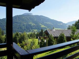 a view from the porch of a house with mountains at Chalet Grand Wastl in Wörgl