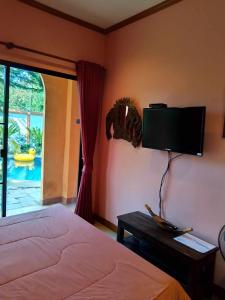 TV a/nebo společenská místnost v ubytování Nirvana Pool Villa 2