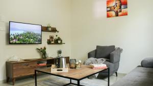 a living room with a couch and a coffee table at Tilia Hotel Beirut in Beirut