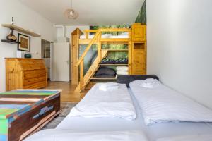 a bedroom with two beds and a bunk bed at Next to Stadthalle & Westbahnhof in Vienna