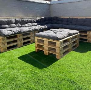 a living room with a couch and green grass at Central Luxury Town House in Blackpool