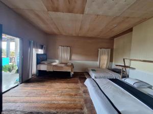 Postel nebo postele na pokoji v ubytování Smiley's Homestay