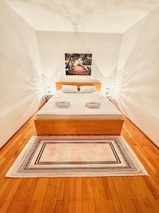 a bedroom with a bed in a room at Mia Apartment in Budva