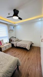 Uma cama ou camas num quarto em ECO Staycation - En Casa Orila