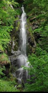 a waterfall on the side of a mountain at Gästehaus Senger in Bestwig