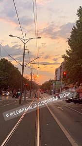 a view of a city street with a sunset at Apartment Boulevard in Belgrade