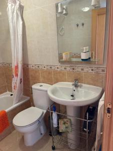 a bathroom with a toilet and a sink at Carolina apartamento de Luxe in Mazarrón