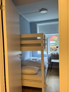a bunk bed in a small room with a bunk bed at Dokkeveien Apartment in Bergen