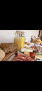 a table topped with bread and a bottle of orange juice at Knockview in Aughrim