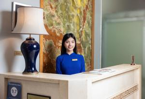 Členové personálu v ubytování Bella Rosa Hotel & Travel