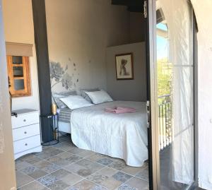 a bedroom with a bed and a window at Villa Torre Macastre, Valencia in Macastre