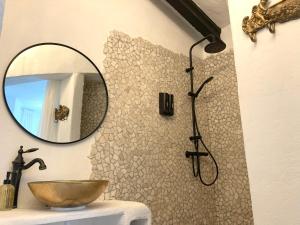 a bathroom with a shower with a sink and a mirror at Villa Torre Macastre, Valencia in Macastre +24 photos