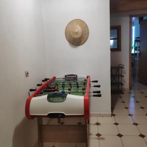 a foosball table against a wall in a room at Maison Cosy et Conviviale, Le B7 in Besset