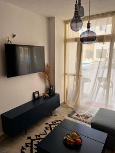 TV tai viihdekeskus majoituspaikassa Port Ghalib Apartments