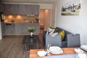 a living room with a couch and a table at Apartment Sabrina in Kitzbühel