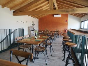 a row of tables and chairs in a restaurant at Il Viaggio Impresa Sociale in Bicchignano