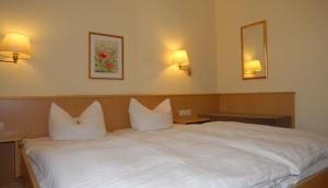 Ένα ή περισσότερα κρεβάτια σε δωμάτιο στο Hotel Garni Grottental