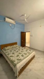 a bedroom with a bed in a room at Sonchafa Stays in Nagaon