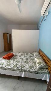 a bed sitting in a room with at Sonchafa Stays in Nagaon
