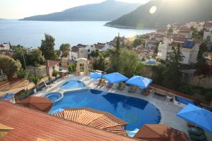 a view of a resort with a large swimming pool at Soothe Hotel in Kalkan