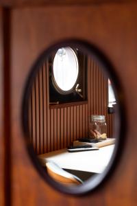 a reflection of a table in a mirror at Houseboat-Amsterdam-Classic in Amsterdam