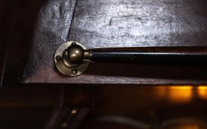a bronze door knob on a wooden table at Houseboat-Amsterdam-Classic in Amsterdam