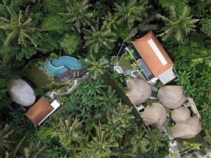 an aerial view of a resort with a swimming pool at Amarea Resort & Spa Ubud by Ini Vie Hospitality in Ubud