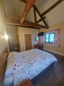 a bedroom with a large bed in a room at Padley Farm in Bradfield