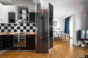 a kitchen with a stainless steel refrigerator at Rocco, Nilie Hospitality MGMT in Thessaloniki