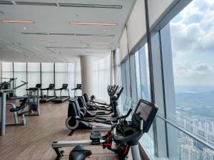 a gym with treadmills and exercise equipment in a building at Na Lotus Hotel, a Luxury Collection Hotel, Nanning in Nanning